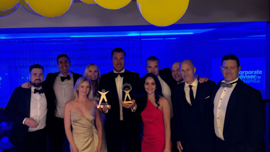 Medicash sales team holding two new awards at the Corporate Adviser Awards in June 2024.