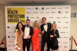 Medicash staff accept best cash plan provider award at the Health & Protection awards 2024