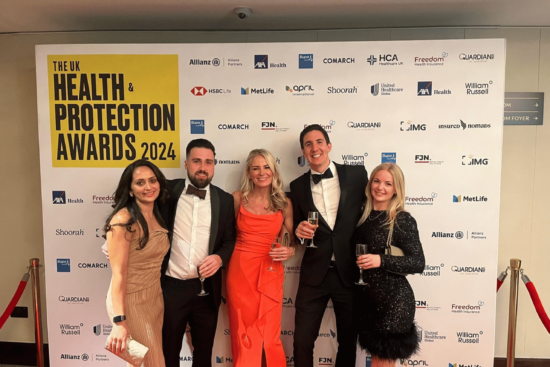 Medicash staff accept best cash plan provider award at the Health & Protection awards 2024